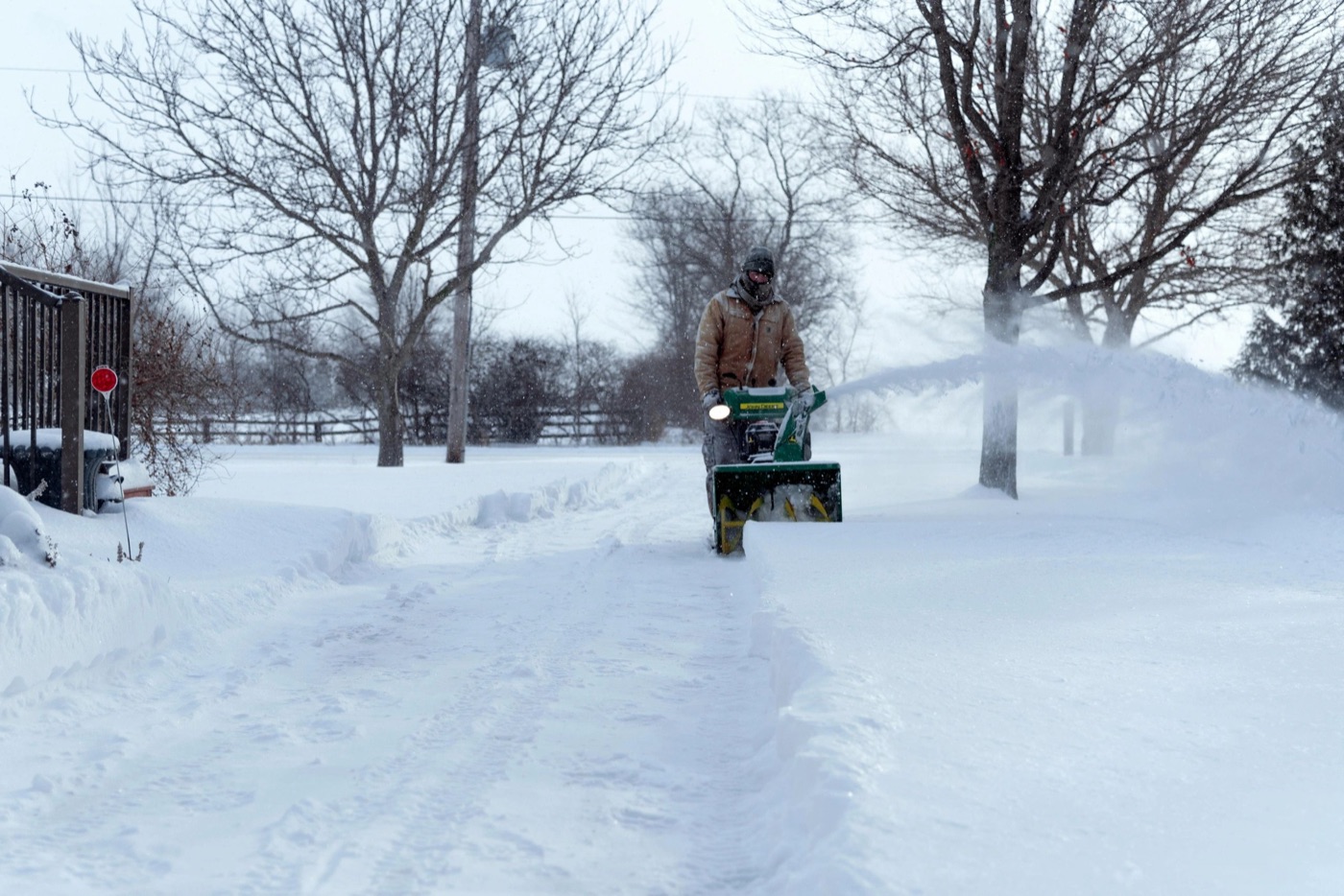 Clearing a driveway with a snow blower